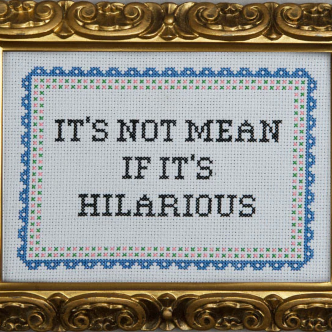 A cross stitch pattern that says "It's not mean if it's hilarious" with a blue scalloped border
