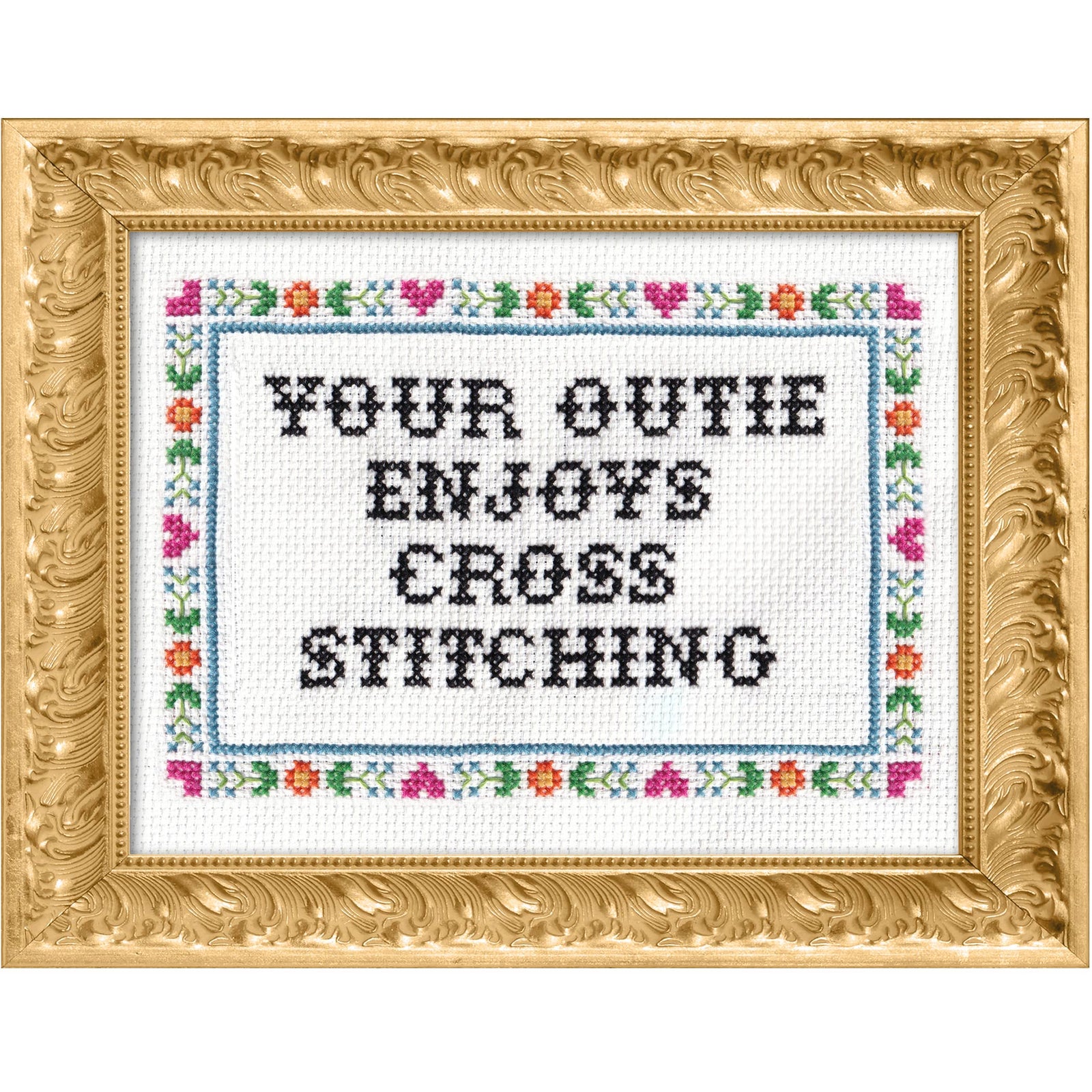 Cross-stitched text that says "your outie enjoys cross stitching" in a decorative gold frame with floral border
