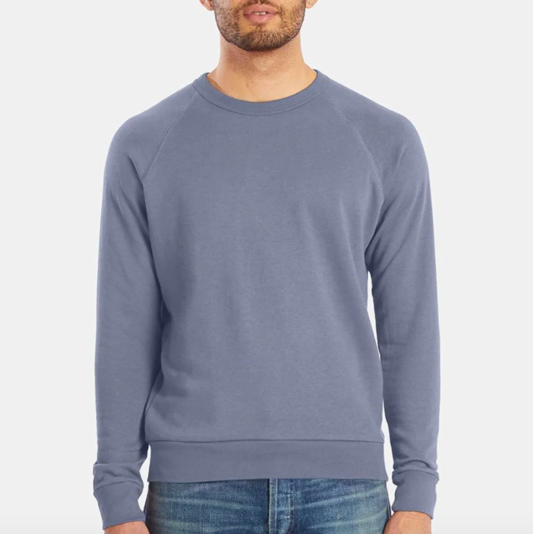Man wearing a blue sweatshirt on a white background.