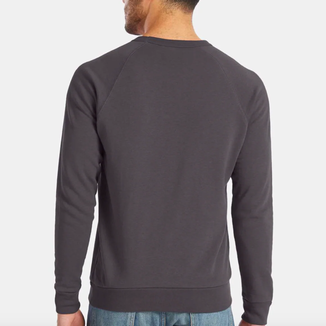 Man wearing a dark gray sweatshirt on a white background