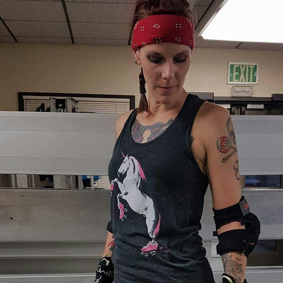 Customer modeling our roller skating unicorn tank top. 