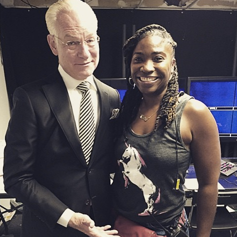Tim Gunn from Project Runway poses with a customer wearing our roller skating unicorn tank top. 