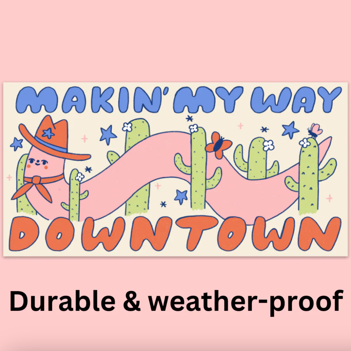 A bumper sticker of a cartoon worm wearing a cowboy hat, cactuses and text that says "Makin' my way downtown"