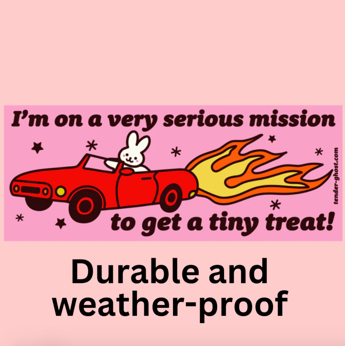 Bumper sticker with a cartoon rabbit driving a car with flames, and text that says "I'm on a very serious mission to get a tiny treat!" on a pink background