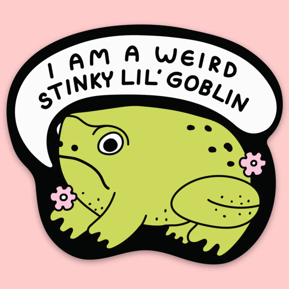 A sticker of a frog with a speech bubble that says "I am a weird stinky lil' goblin"
