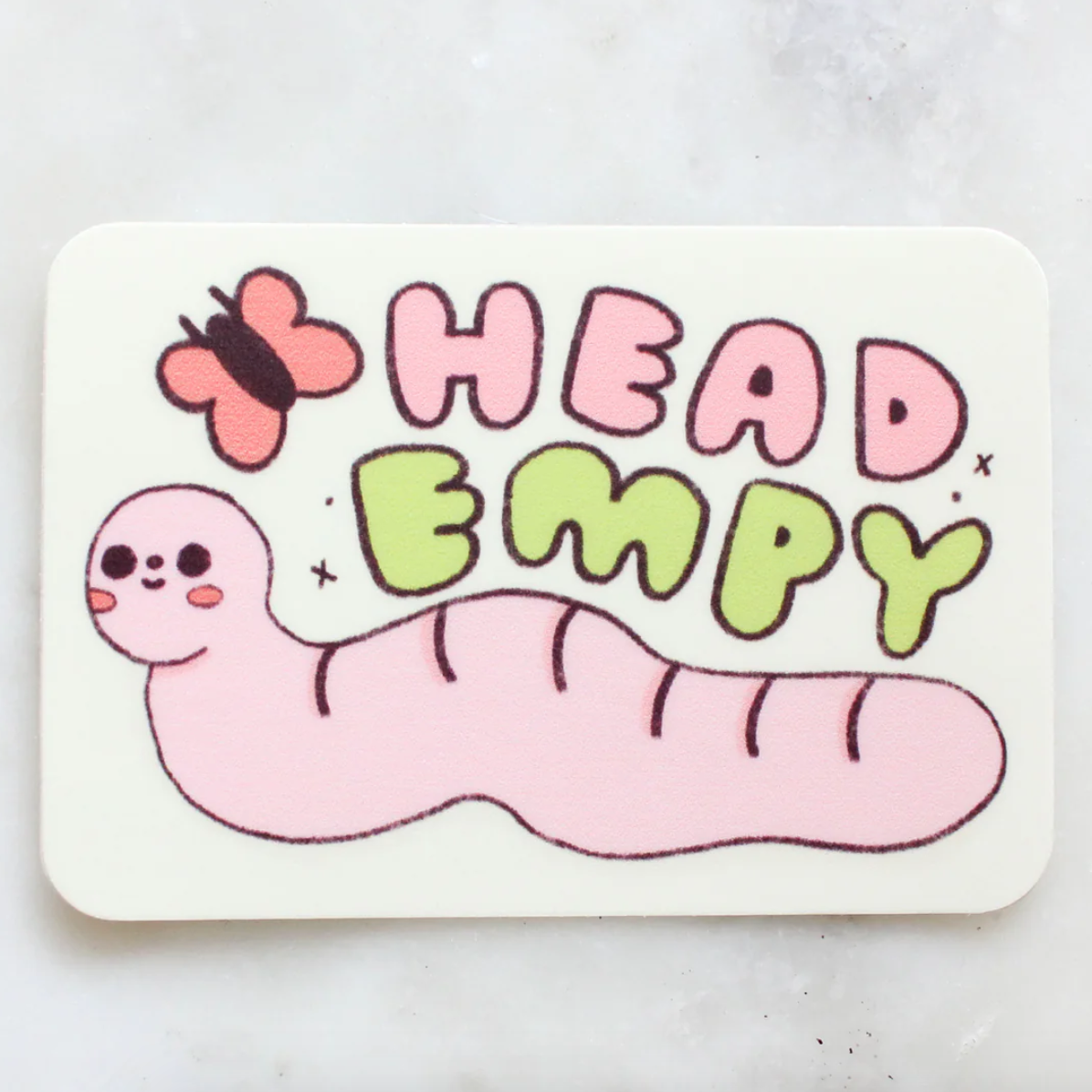 Sticker with a pink worm and butterfly illustration and 'HEAD EMPTY' text on a white background.