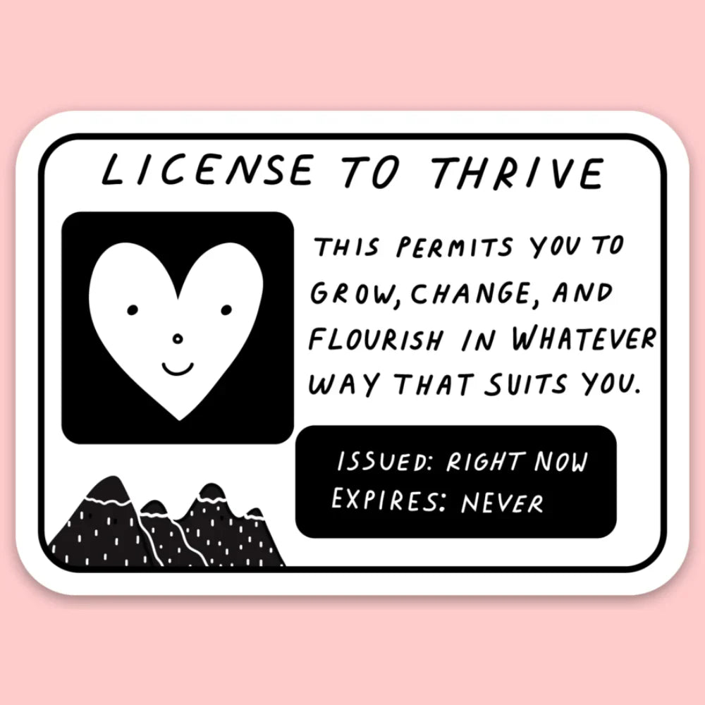 Sticker in black and white with a smiling heart and text that says "license to thrive"