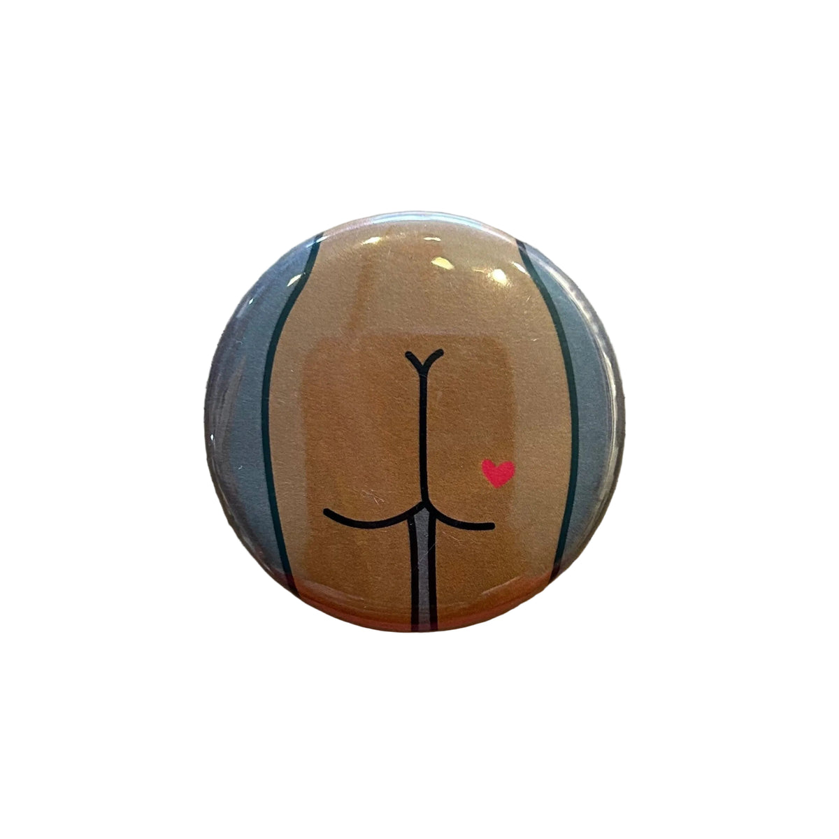 Round button with a design of a butt with a heart tattoo. 