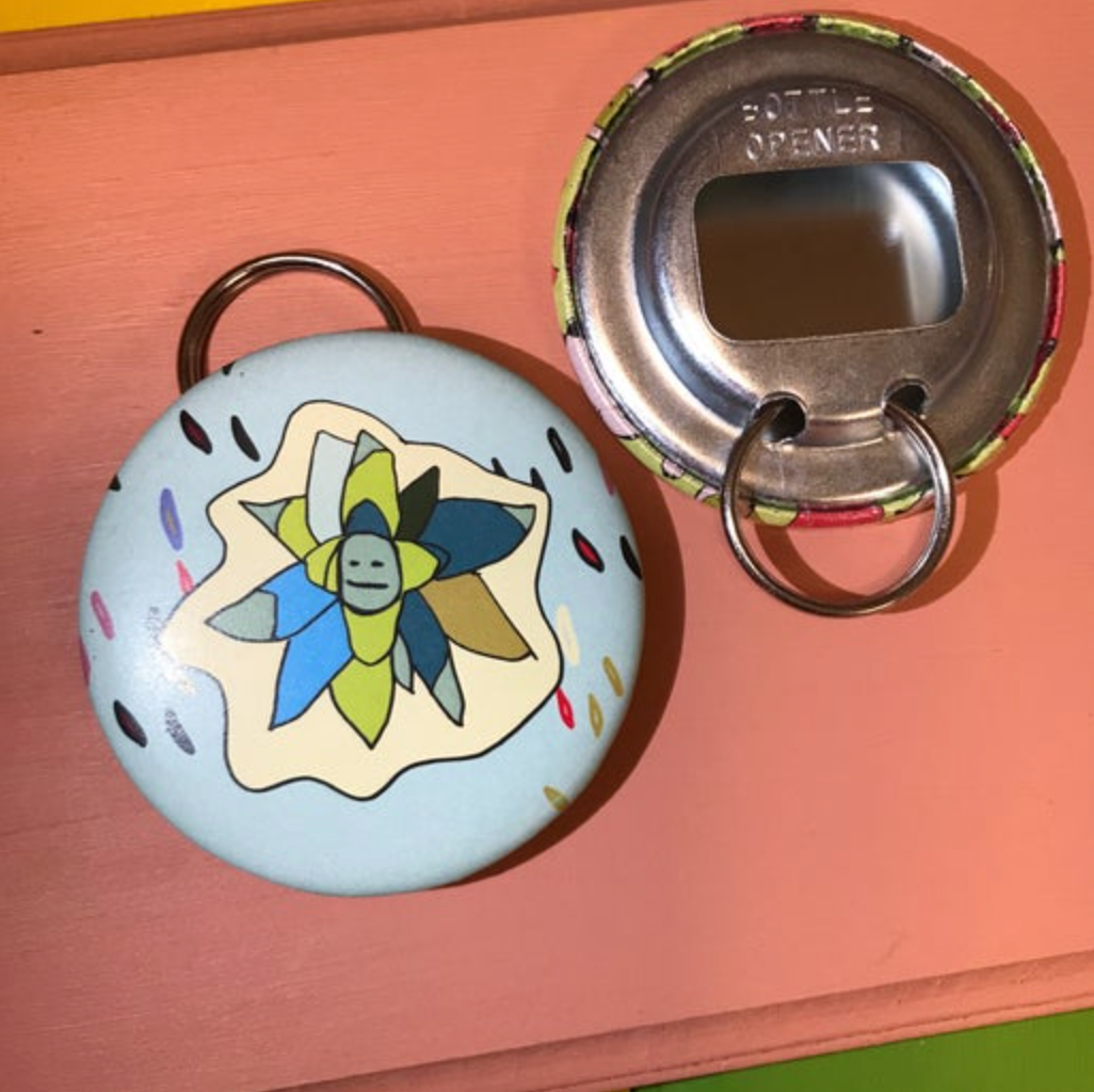 Decorative bottle opener with succulent design on a light peach background