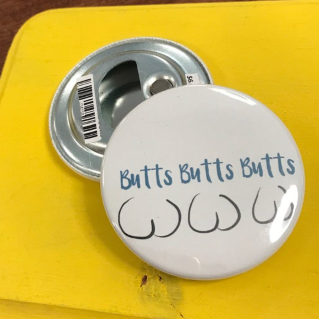 Round bottle opener magnet with 'Butts Butts Butts' text on a yellow background