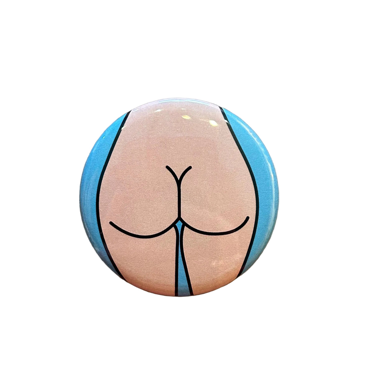 Round button with a stylized depiction of a butt 