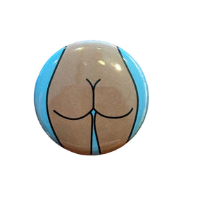 Button badge with a stylized illustration of a butt 