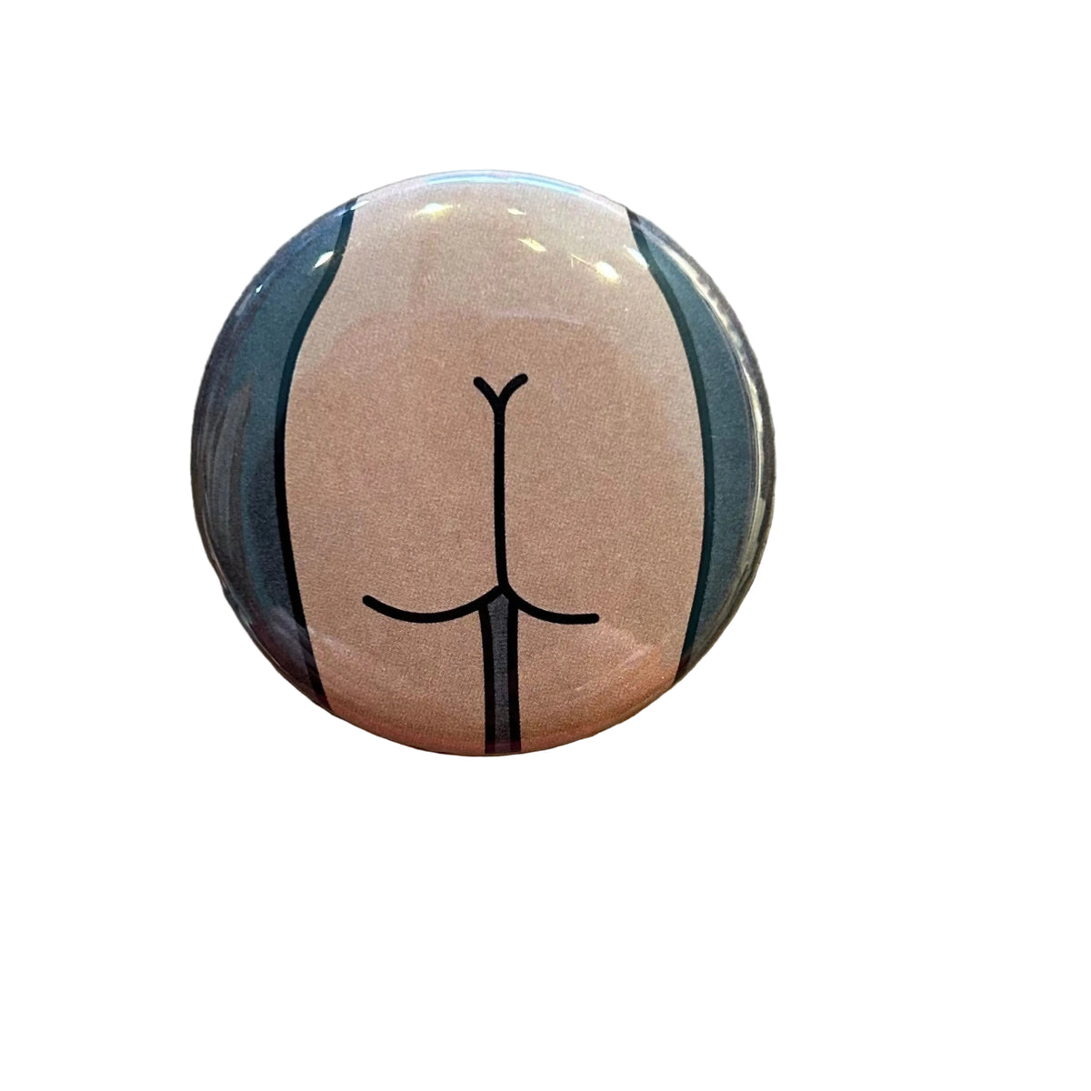 Round button with a stylized drawing of a butt with a dark gray background. 