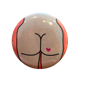 Round button with a design of a butt