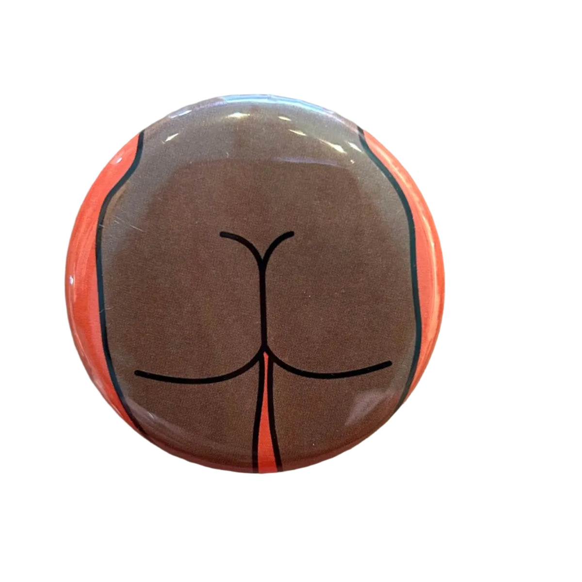 Round button with a stylized butt design on an orange background. 
