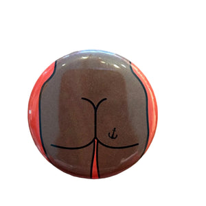 Button badge with a butt design 