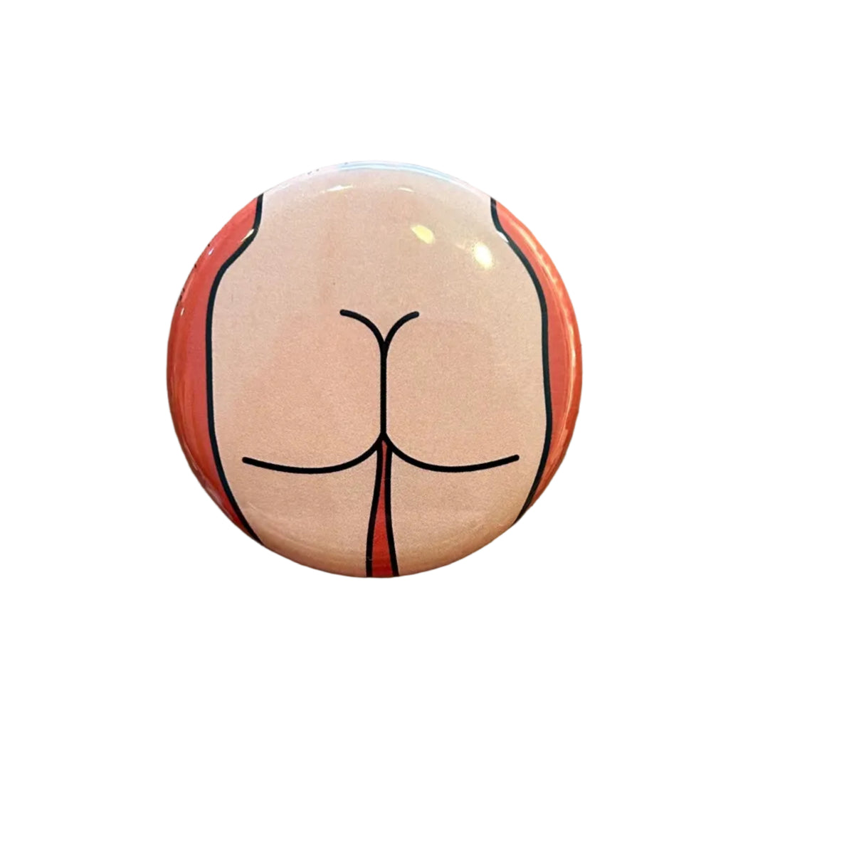 Round button with a design of a buttocks on a textured surface