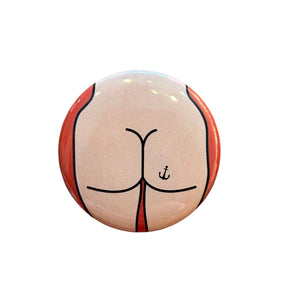 Round button badge with a butt design 