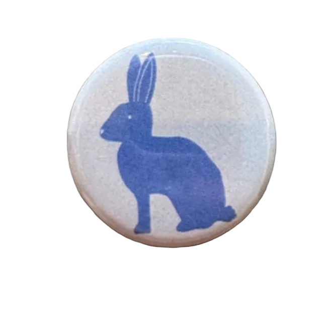 Round button with blue rabbit silhouette 