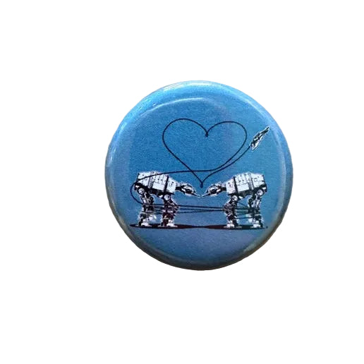 Button badge with two robots forming a heart on a blue background