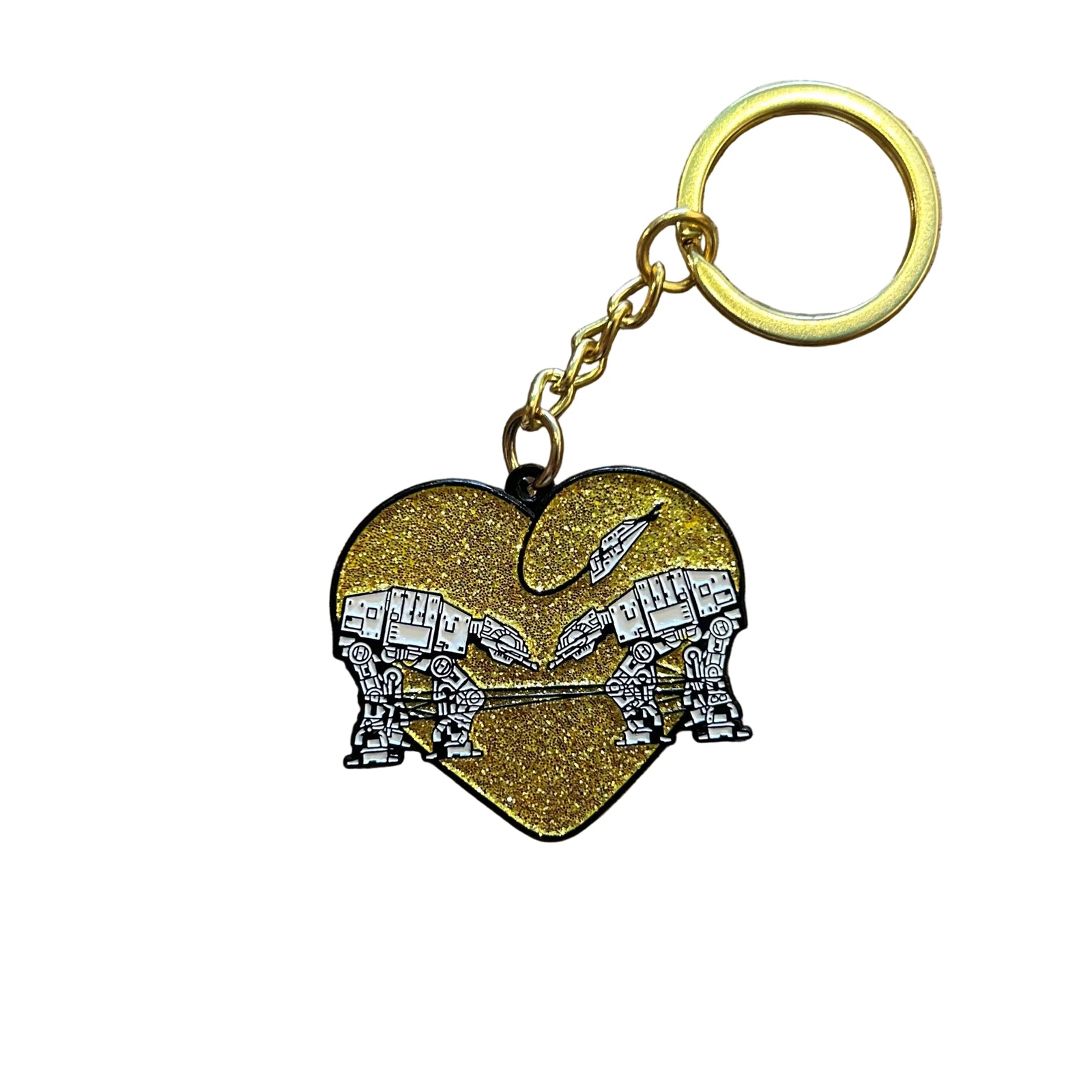 A gold glitter keychain of two robots surrounded by a heart against a white background 