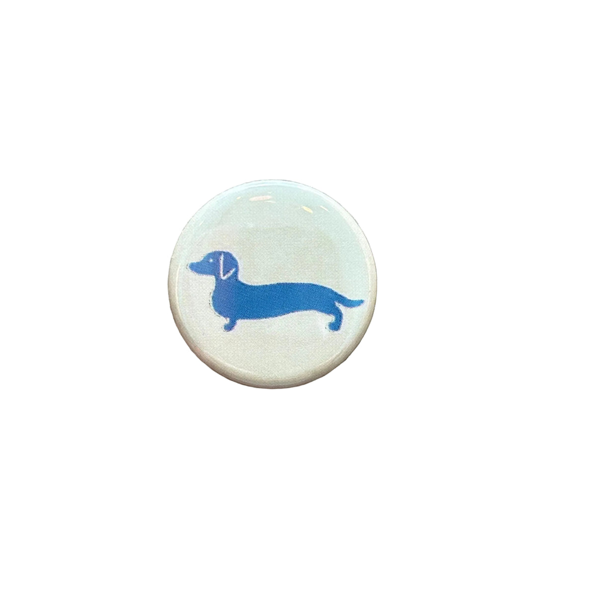 Round white magnet with a drawing of a dachshund in blue, against a white background. 