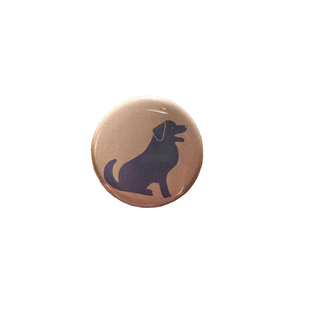 A round white magnet with a blue labrador dog drawing on it.