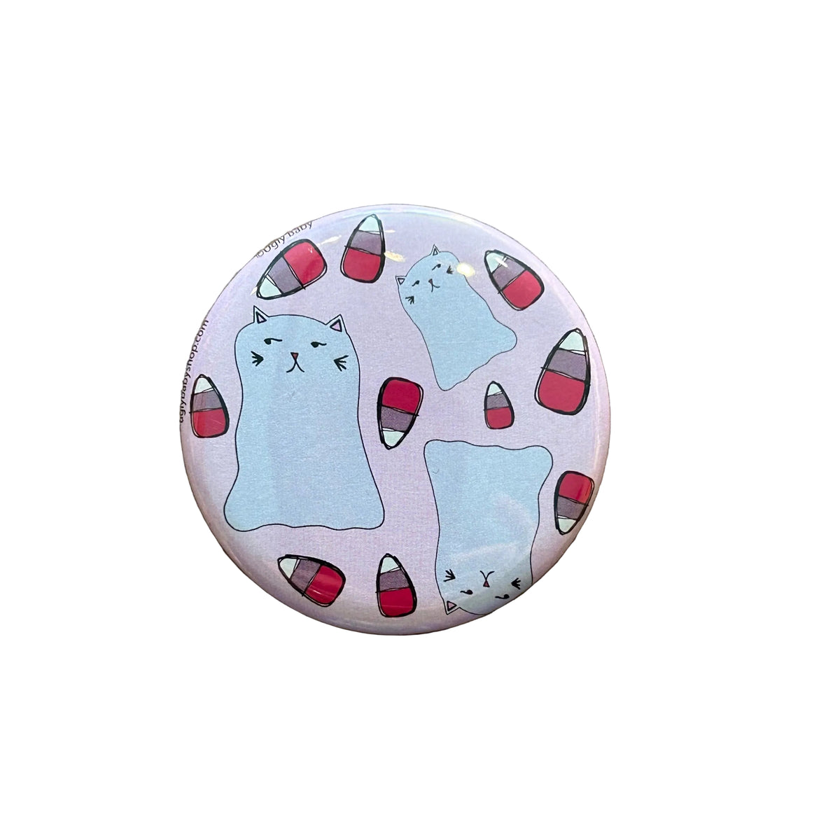 Round pink magnet with illustrations of ghost cats and pink candy corn