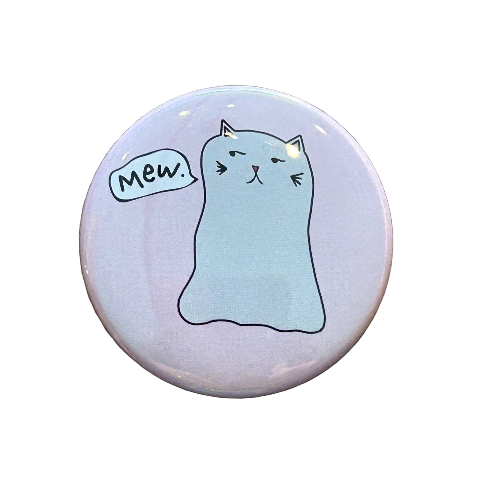 Round pink magnet with a cat ghost illustration and a speech bubble that says "Mew."