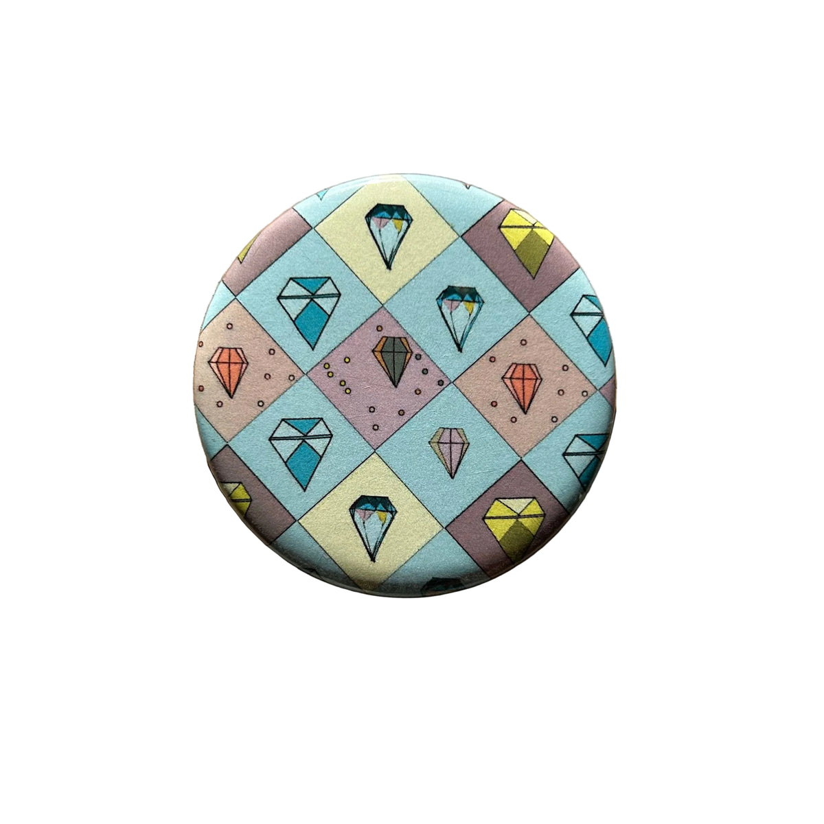 Round magnet with a checkerboard pattern filled in with drawings of different colored gems. 