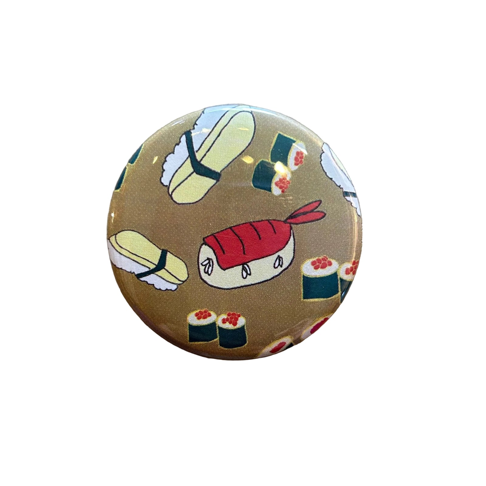 A round magnet featuring a sushi-themed pattern on a tan background