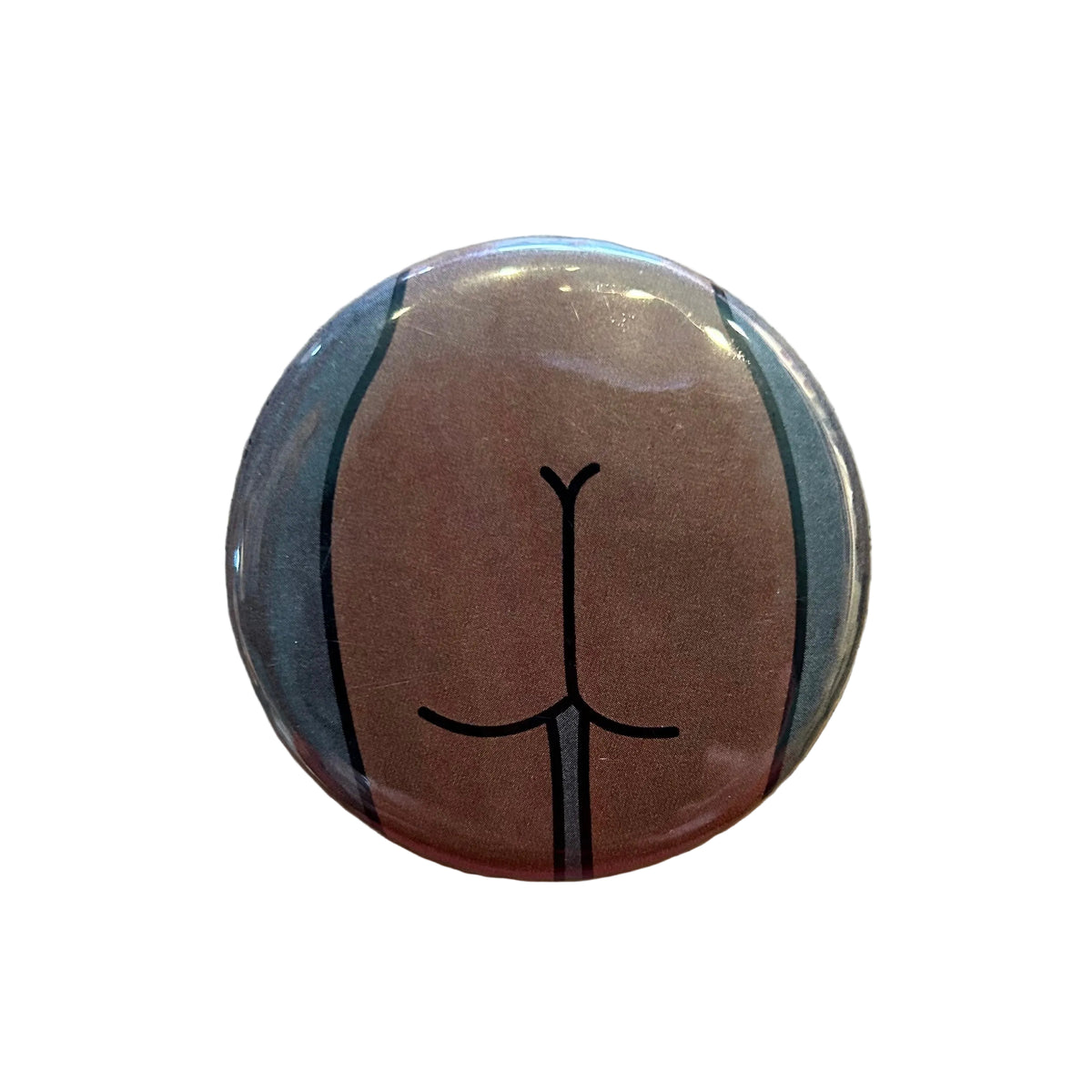 Round mirror with a cartoon illustration of a butt on the back