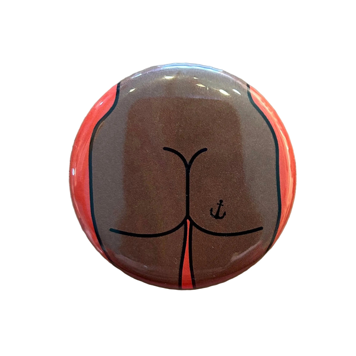 Round mirror with a cartoon illustration of a butt with an anchor tattoo on the back