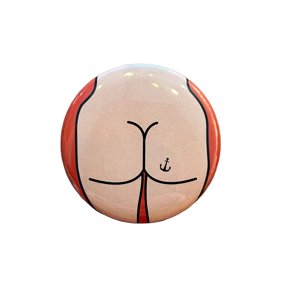 Round mirror with a design of a cartoon butt on the back