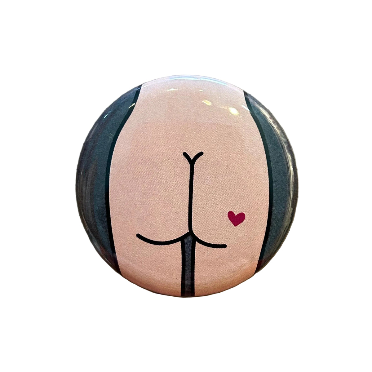 Round mirror with a design of a cartoon butt on the back
