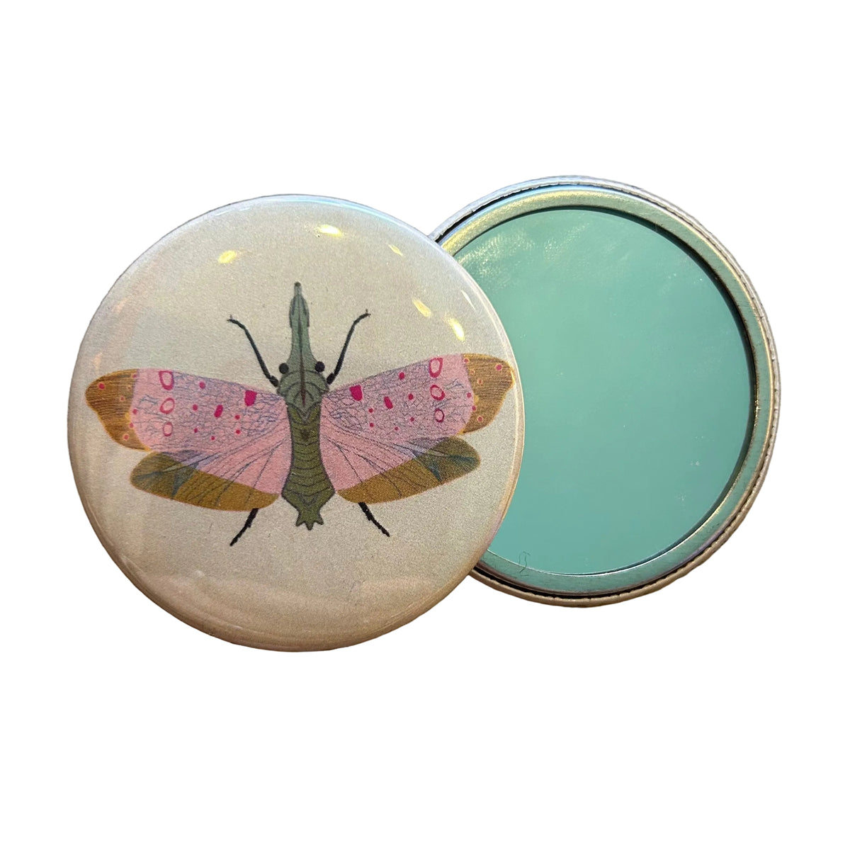 Round mirror with an illustrated moth design in pink, green, and orange. 
