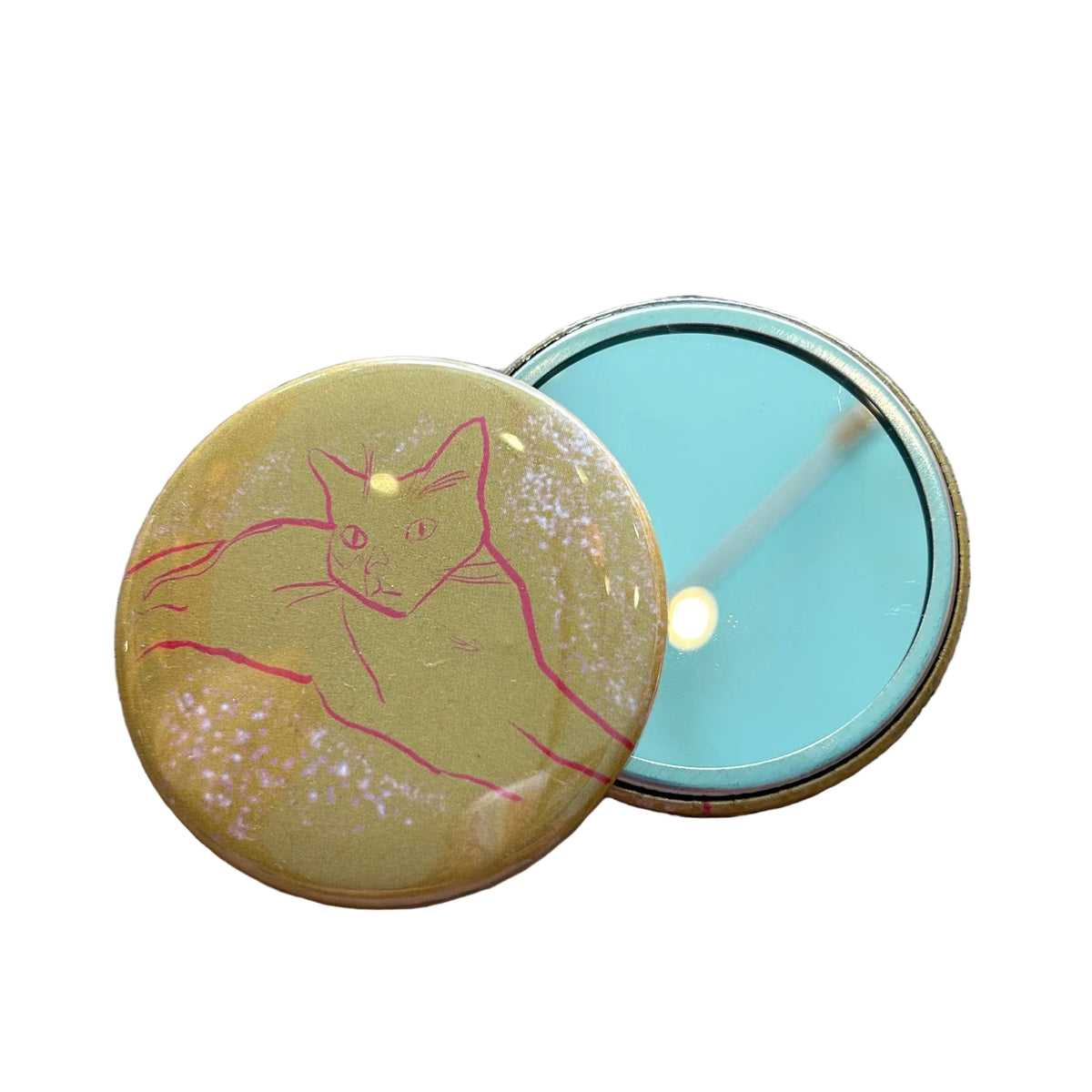 A round yellow mirror with an illustration of a cat on it. 