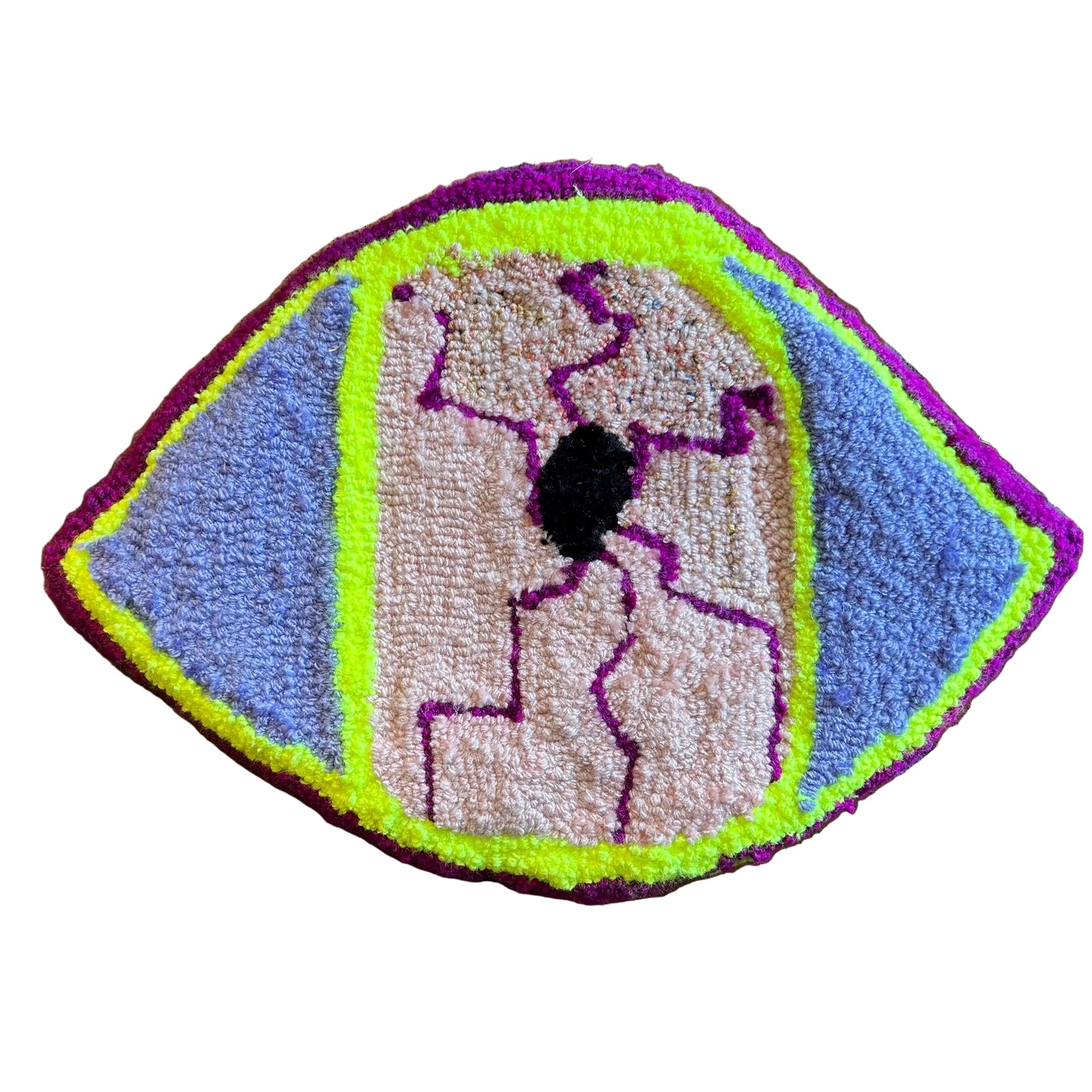 A piece of tufted artwork in the shape of an eyeball with pink, purple, lilac, and neon yellow colors.