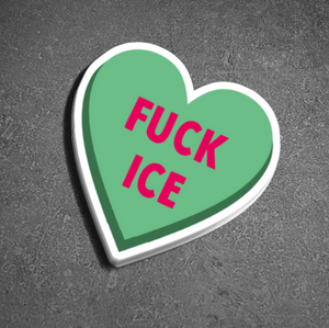 Heart-shaped sticker with 'FUCK ICE' text on a gray background
