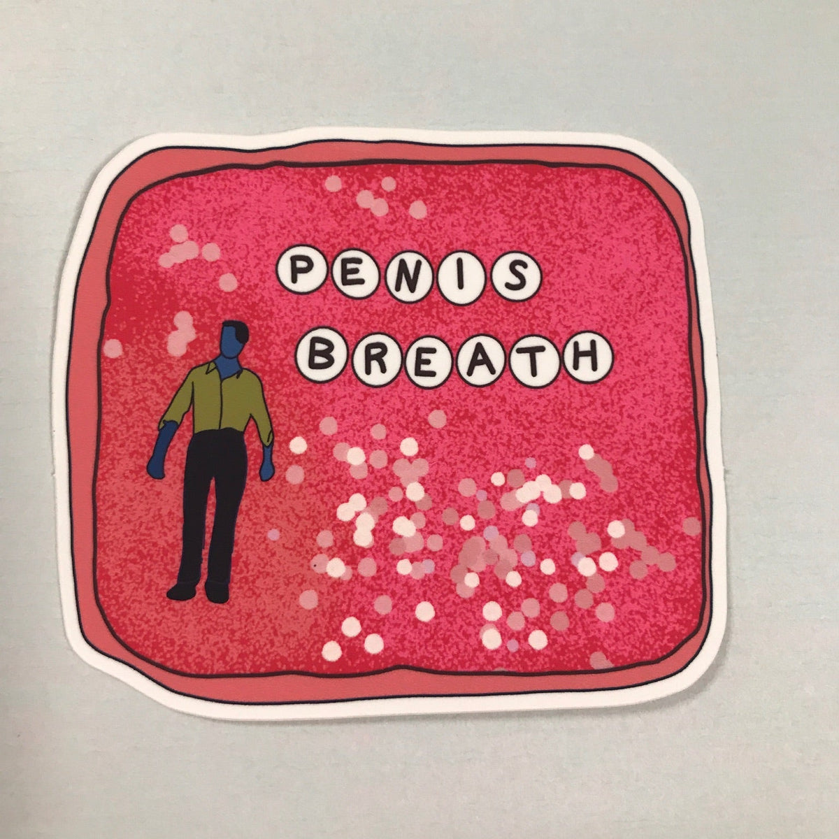 Sticker with 'Penis Breath' text and a person icon on a red background