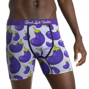 Underwear with eggplant pattern and 'Good Luck Undies' branding on a white background