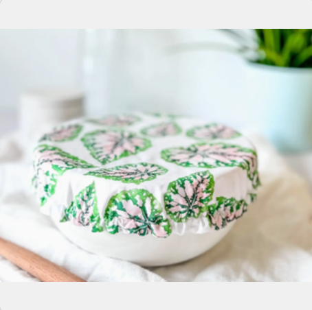 Round ceramic dish with floral pattern on a white surface