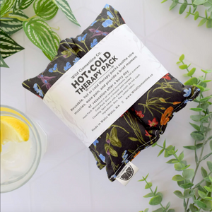 Hot and cold therapy pack with floral design on a white background