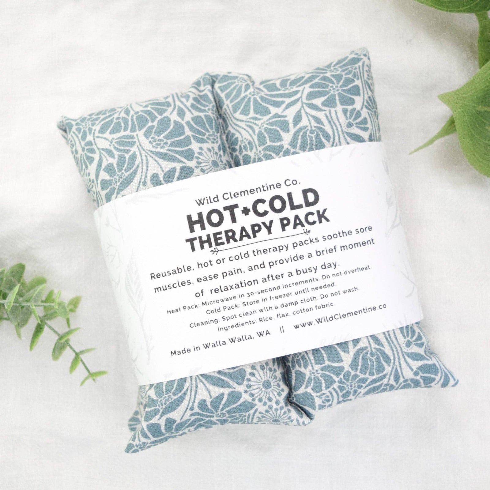 Hot and cold therapy pack with floral design on a white background