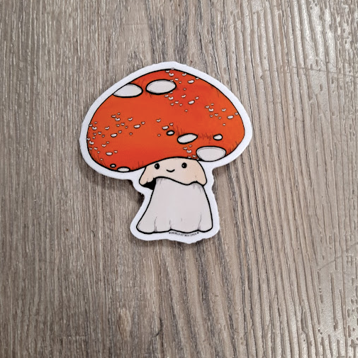 Cartoon mushroom sticker on a wooden surface