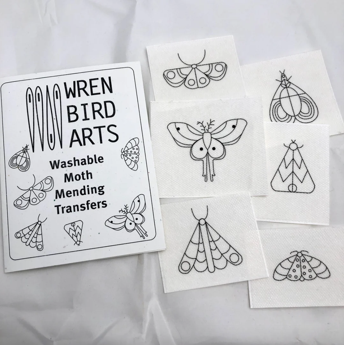 A package of embroidery transfers with six different moth designs. 
