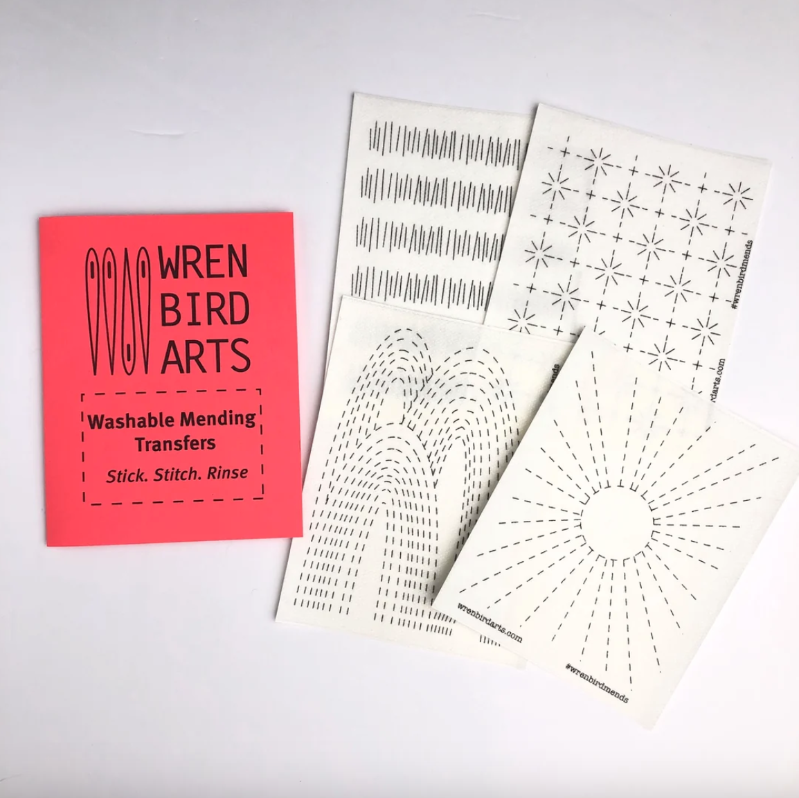 A package of four mending transfers from Wren Bird Arts. 