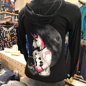 Black hooded sweatshirt with a roller skating unicorn astronaut screenprinted on the back in white and hot pink. 