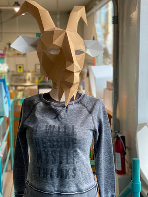 Gray fleece sweatshirt that says "I Will Rescue Myself, Thanks" in darker gray lettering. It is shown on a mannequin that is topped with a cardboard goat head for some reason. 