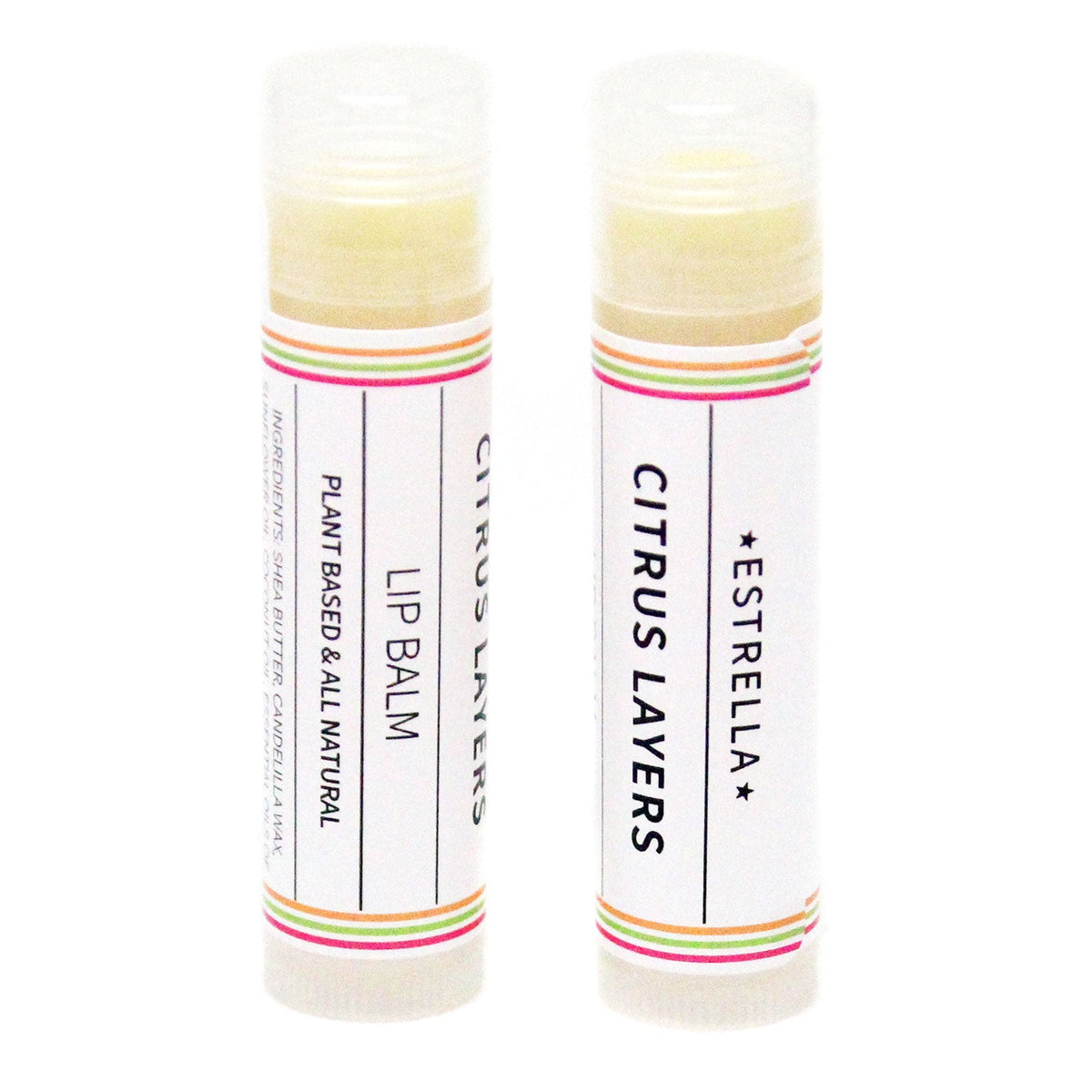 Two tubes of lip balm with a white label that has orange, green, and red stripes and says "Estrella: Citrus Layers: Lip Balm"